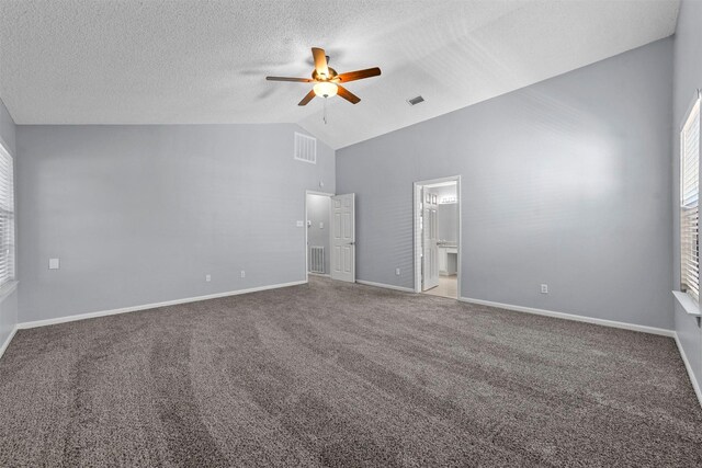 spare room with carpet flooring, ceiling fan, and a textured ceiling