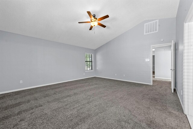 unfurnished room featuring a textured ceiling, lofted ceiling, ceiling fan, and carpet