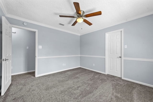 carpeted spare room with a textured ceiling, crown molding, and ceiling fan