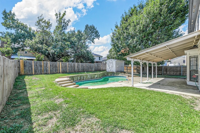 view of yard featuring a fenced in pool, a storage shed, and a patio