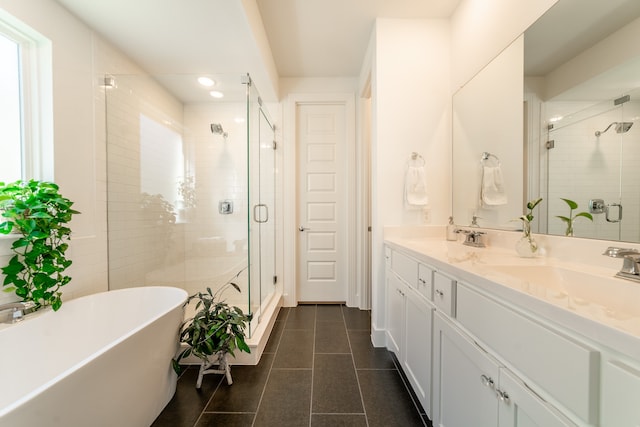 bathroom with tile patterned flooring, vanity, and independent shower and bath