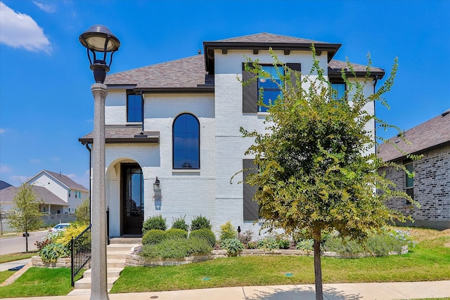 view of front of home with a front yard