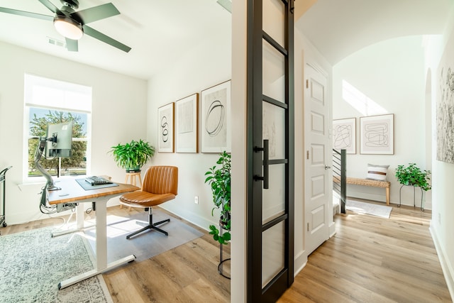 office area featuring light hardwood / wood-style flooring and ceiling fan