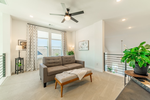 living room with light carpet and ceiling fan