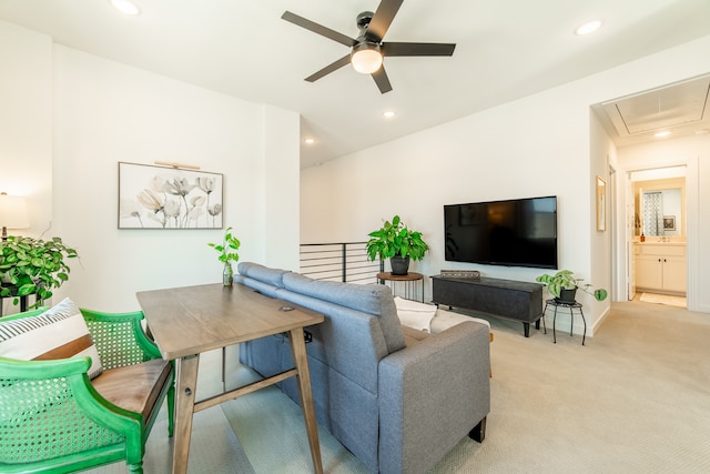 carpeted living room featuring ceiling fan