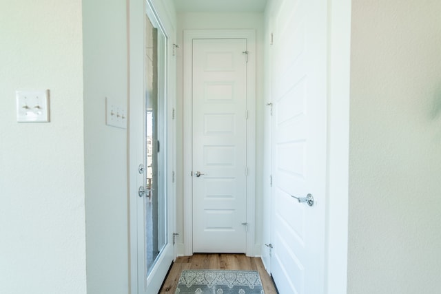 hallway with light wood-type flooring