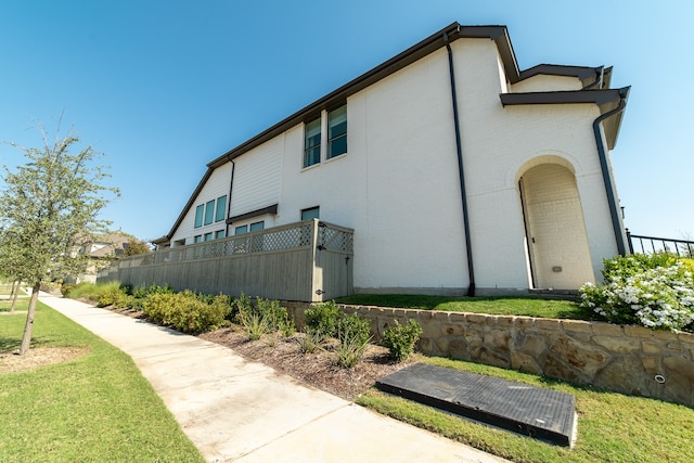 view of home's exterior featuring a lawn