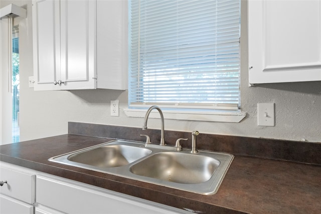 kitchen with sink and white cabinets