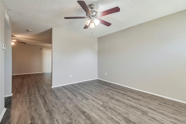 unfurnished room with a ceiling fan, a textured ceiling, baseboards, and wood finished floors