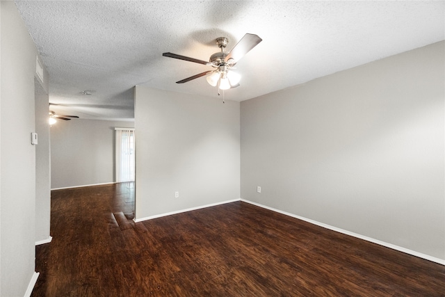 empty room with a textured ceiling, wood-type flooring, and ceiling fan