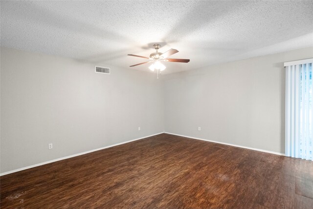 empty room featuring hardwood / wood-style floors, ceiling fan, and a textured ceiling