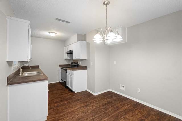 kitchen featuring black range with electric stovetop, dark wood-type flooring, and hanging light fixtures