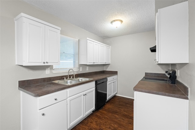 kitchen with dishwasher, electric range, dark hardwood / wood-style flooring, sink, and a textured ceiling