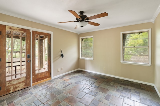 empty room featuring ceiling fan and ornamental molding