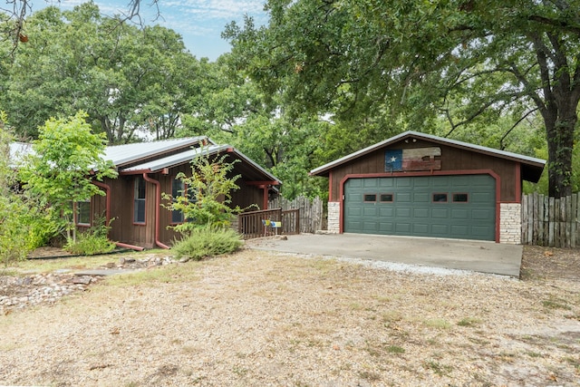 view of front facade with an outdoor structure and a garage