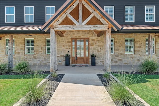 property entrance with a porch and a lawn