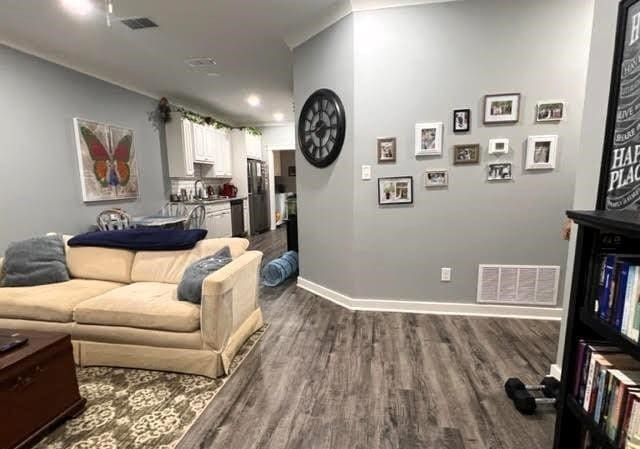 living room with dark hardwood / wood-style floors