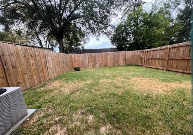 view of yard featuring central AC