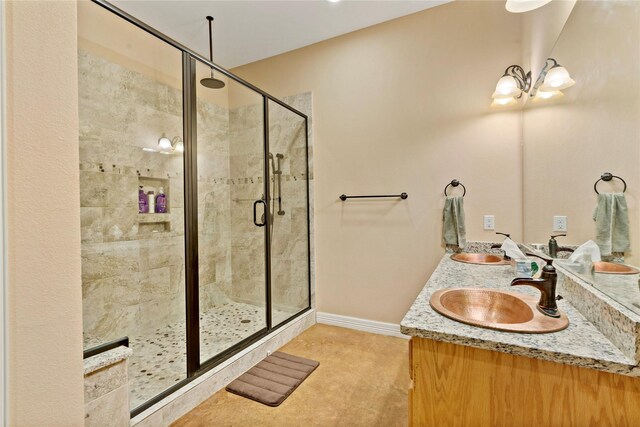 bathroom featuring vanity and an enclosed shower