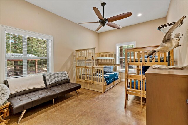 bedroom featuring ceiling fan and multiple windows