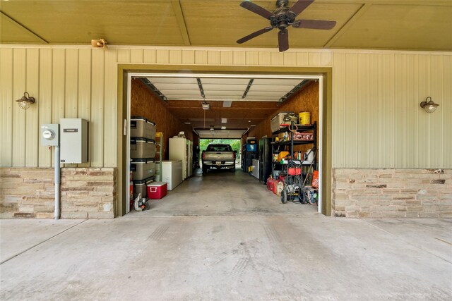 garage with ceiling fan and wooden ceiling