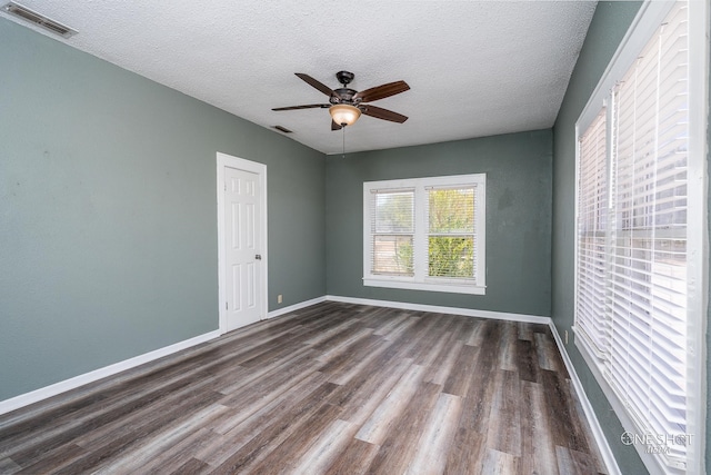 unfurnished room with a textured ceiling, ceiling fan, and hardwood / wood-style floors