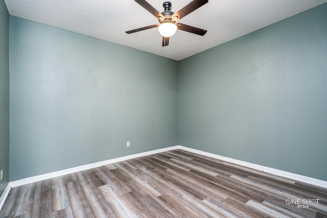 unfurnished room with a textured ceiling, hardwood / wood-style flooring, and ceiling fan