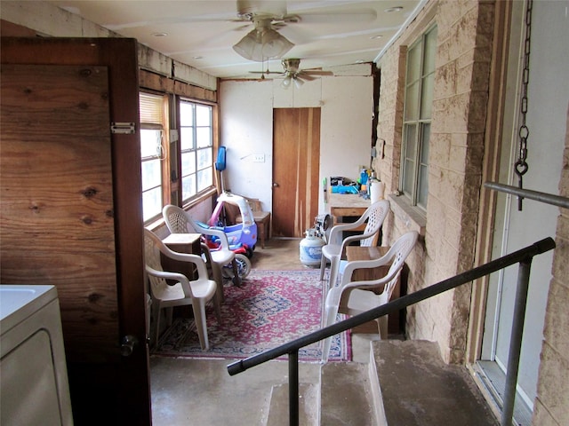 interior space featuring washer / clothes dryer and concrete flooring