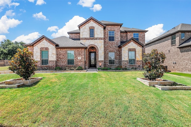 view of front of home with a front yard