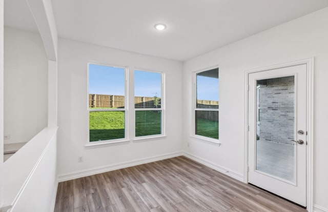 spare room featuring light wood-type flooring