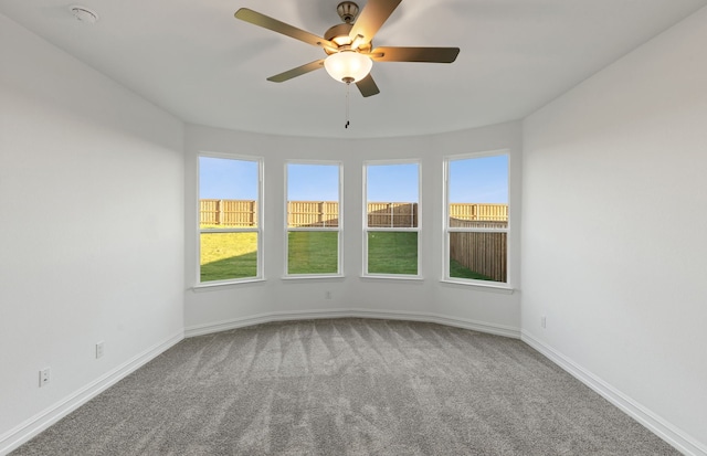 empty room with carpet and ceiling fan