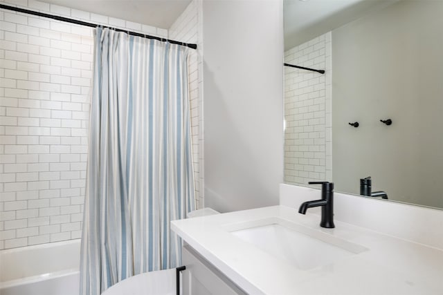 full bathroom featuring shower / tub combo, vanity, and toilet