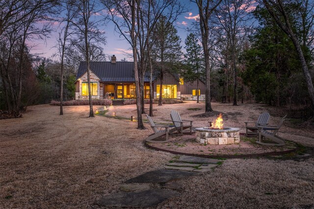 exterior space featuring a patio and a fire pit