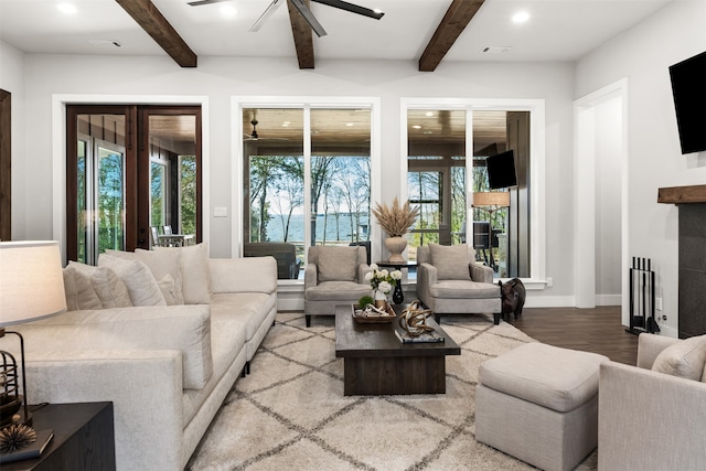 living room with ceiling fan, french doors, beam ceiling, and hardwood / wood-style floors