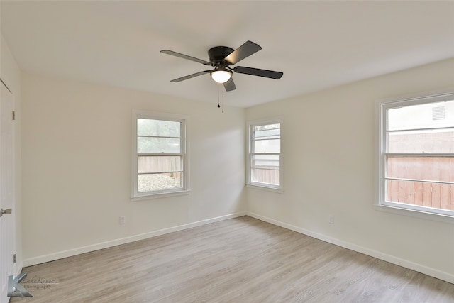 unfurnished room with ceiling fan and light hardwood / wood-style floors