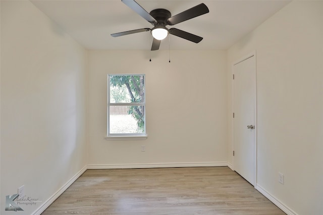 spare room featuring ceiling fan and light wood-type flooring