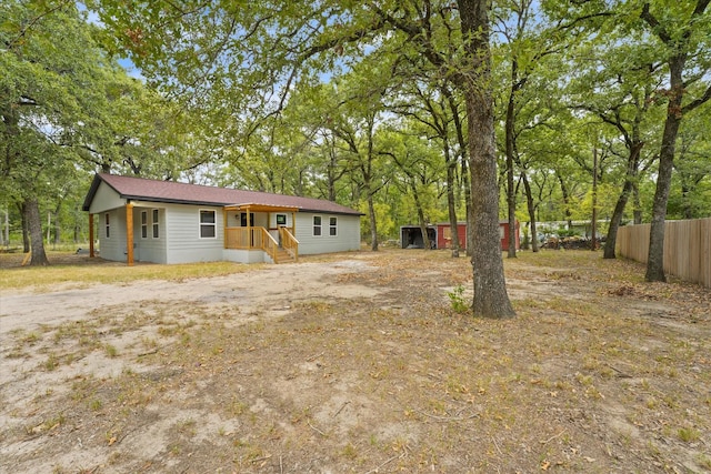 view of front of property featuring fence