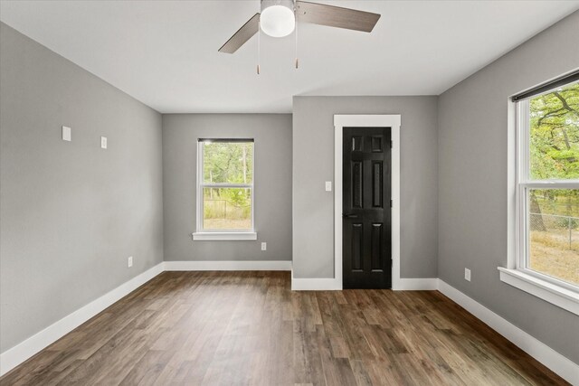 entryway with wood-type flooring and ceiling fan