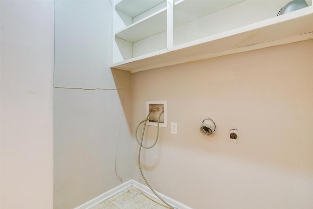 clothes washing area featuring laundry area, hookup for a washing machine, electric dryer hookup, and baseboards