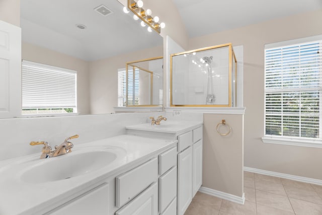 bathroom featuring vanity, plenty of natural light, and a shower with door