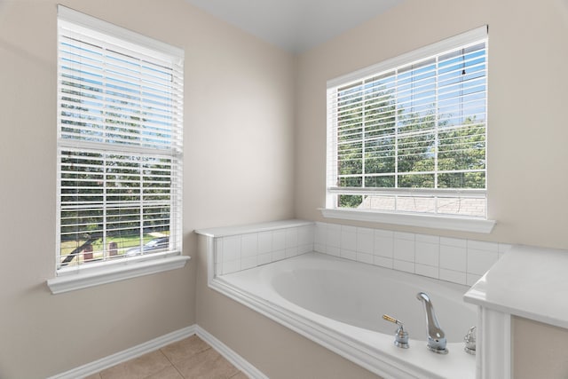 bathroom featuring tile patterned flooring and a washtub