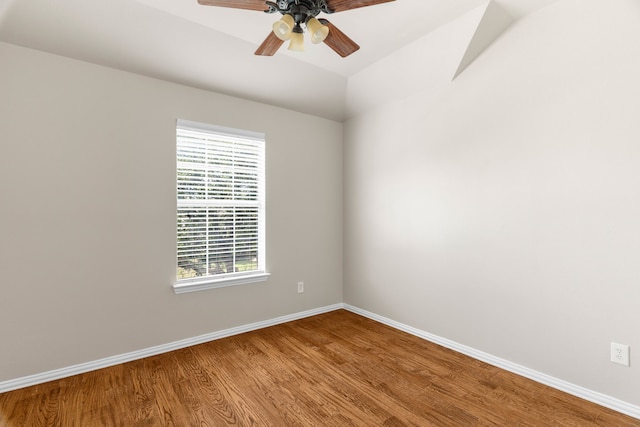 unfurnished room with a healthy amount of sunlight, ceiling fan, and hardwood / wood-style floors