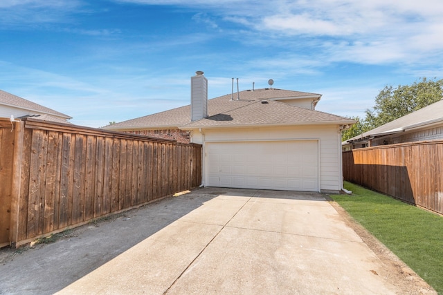 garage with a lawn