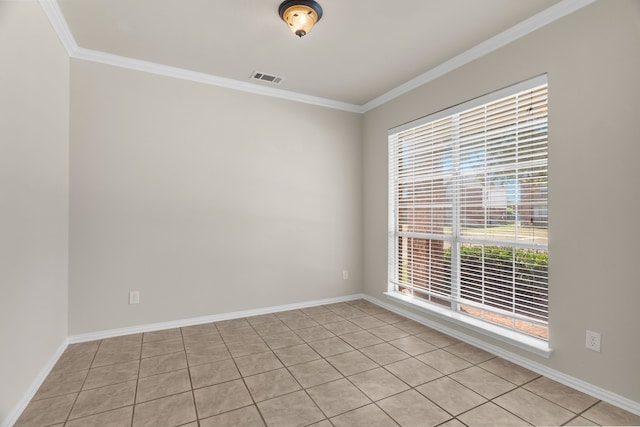 tiled empty room featuring ornamental molding