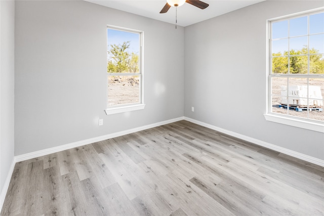 unfurnished room featuring ceiling fan and light hardwood / wood-style floors