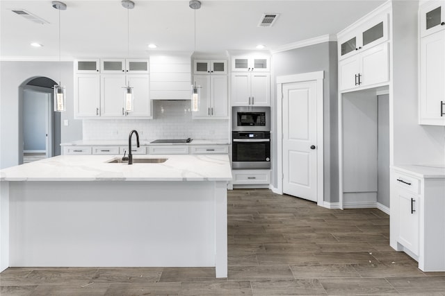 kitchen featuring white cabinets, hardwood / wood-style floors, stainless steel appliances, and sink