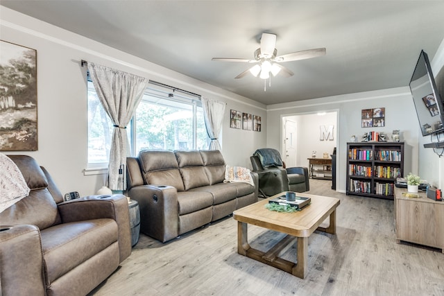 living room featuring light hardwood / wood-style floors and ceiling fan