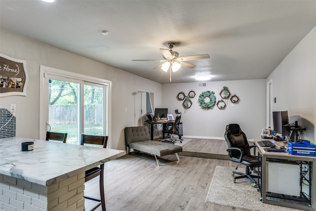 office featuring ceiling fan and wood-type flooring