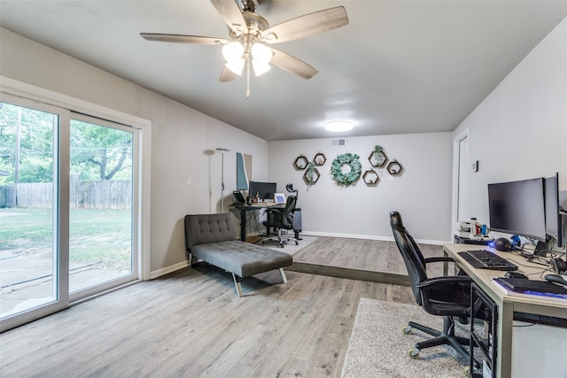 office area with light hardwood / wood-style floors and ceiling fan