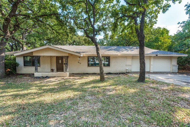 single story home with a front yard and a garage